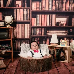 A curious little gentleman looking right at the camera. I always watch for these precious, awake moments during a themed baby shoot to capture their budding personality.