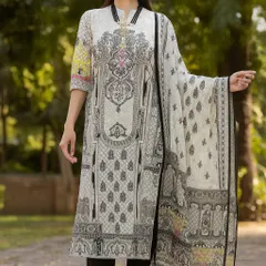 You can never go wrong with a classic black and white printed suit. This set features a straight-cut kurta with an intricate, architectural print and comes with a light, matching dupatta finished with playful tassels. It's a sophisticated look that is perfect for the office or a semi-formal dinner.