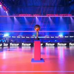 The Prime Volleyball League trophy stands proudly on the court before a match. We manage the entire on-court presentation, including lighting and branding, to create a professional and exciting atmosphere.