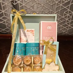 The complete view of our exclusive trunk box for Diwali. This hamper combines a fruit tea cake, decorative tins, and diyas for a wholesome festive gift.