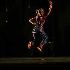 The dynamic energy of 'Shringara Sharanagati' captured in a single frame. This pose reflects the joyous abandon of the Gopikas as they dance for Krishna, a key element of the 'raas' lila.