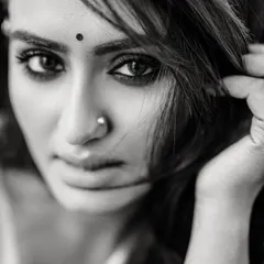 An intense and raw black and white close-up. This style of portraiture is about capturing pure emotion, stripping away all distractions.