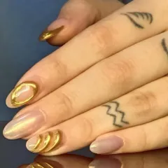 A unique and artistic design featuring 3D sculpted gold chrome accents on a pearlescent base, creating a modern, textured effect.
