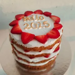 The finished strawberry naked cake, a light and fruity option for any celebration.