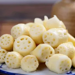 These are the fresh, raw lotus stems I use for my pickle. I source only the best quality produce to ensure a crisp texture and authentic taste.