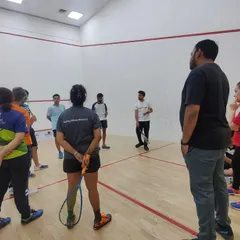 Players listening intently as Ravi Dixit shares his expertise. Our coaching camps are focused on providing practical guidance and inspiration.