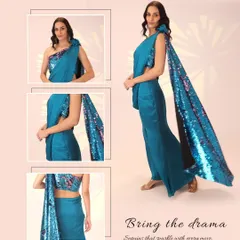 I love designing outfits that bring a little drama, and this modern drape saree does just that. The highlight is the one-shoulder blouse and attached pallu, both covered in sparkling sequins that catch the light with every move. It's a unique, head-turning ensemble perfect for a cocktail party or reception.