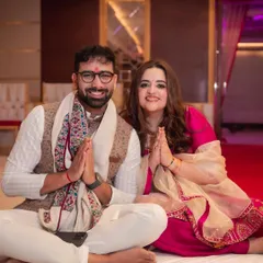 A moment of peace and gratitude during their Mata ki Chowki. The couple sits with hands joined in prayer, seeking blessings for their journey ahead. This is a beautiful start to their wedding festivities.