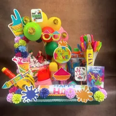 When everything is brimming with the joy and colors of Holi, our hampers are too! This fun arrangement is packed with balloons, water guns, colors, and treats to ensure a happy and playful celebration.
