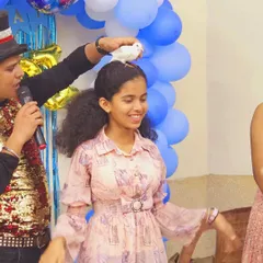 Another guest is amazed as a pigeon magically appears on her head. This interactive trick is always a hit at parties.