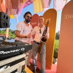 Here I am with a talented saxophonist at a Goa wedding. Adding a live instrument like a saxophone or violin to my DJ set brings a level of elegance and a live performance feel.