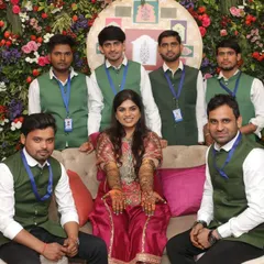 My team and I with a happy bride. For large wedding events, I bring my team of professional artists to make sure all the guests get beautiful mehandi without any delay.