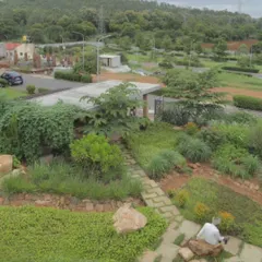 Overlooking the terraced valley of Kaggalipura, this landscape takes advantage of the natural terrain. The design focuses on holding water, recharging the ground, and limiting hard civil lines to create a resilient ecosystem.