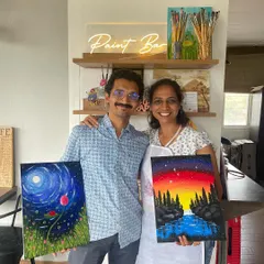 The perfect end to a creative date night. This couple is all smiles with their finished masterpieces, a beautiful reminder of a fun evening spent together.