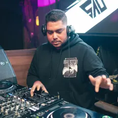 At the helm at Flamiingo Lounge, with my logo on the screen behind me. I bring a professional brand and top-tier equipment to every venue.