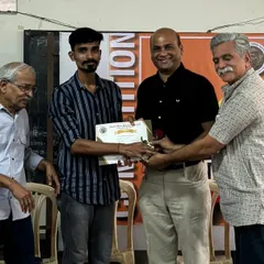 Presenting an award to a winning artist at the Nashik Kalaniketan competition. Recognizing and encouraging talent is a crucial part of my role as a mentor.