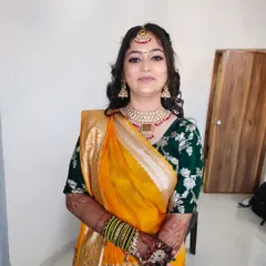 A lovely portrait of a bride ready for her Haldi ceremony. The makeup is fresh and natural, with soft pink tones on the eyes and lips.