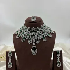 A bold and beautiful silver-finish necklace set with large green stones. This rental piece is perfect for adding a pop of color to your evening gown or lehenga.