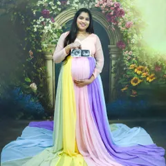 Celebrating twins is twice the fun. This mom-to-be holds her ultrasound scan, proudly showing the first picture of her two little ones.