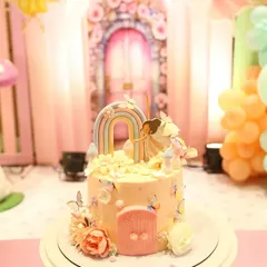 The centerpiece of the "Wonderland" theme was this enchanting cake. We focused on the details, from the tiny fondant door and delicate butterflies to the pastel rainbow, making it a true work of art for the birthday girl.