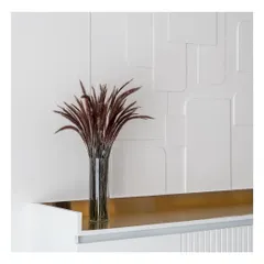 The beauty of a custom 3D wall panel. This close-up shows the clean, curved lines and the subtle play of light and shadow that adds a layer of architectural interest to a dining room wall.