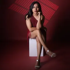 A powerful pose from a studio session. I believe in bringing strength and confidence to the stage, guiding your event with a commanding yet graceful presence.