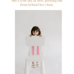 This is how many of our kids' portrait sessions begin, with a little shyness. We give them space and time, letting them peek out from behind a chair until they are comfortable.