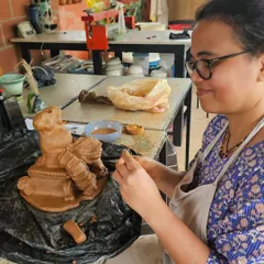 It has become a yearly ritual to make our Ganesha idols together. The whole studio gets filled with positive and spiritual vibes. Here, a participant carefully adds details to her sculpture.