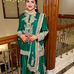A classic red lip for a gorgeous Mehendi look. Paired with an emerald green Anamika Khanna outfit, this makeup is bold, timeless, and incredibly chic.