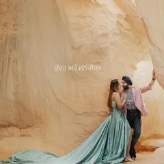 A romantic embrace within the unique rock formations of Turkey. The bride's flowing teal gown adds a touch of cinematic drama to the natural landscape, a signature of my destination photography.