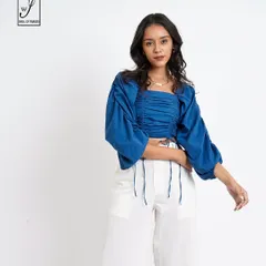 A three-quarter view of the same outfit, showing how the top and trousers pair together for a complete look.