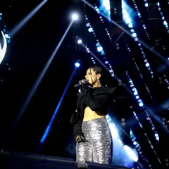 A powerful shot of rapper and singer Agsyworld owning the stage. My concert photography focuses on capturing artists in their element, using dramatic lighting to create iconic images.