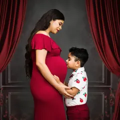 Welcoming a new baby is a family affair. I love capturing moments like this, where an older sibling connects with the baby bump. It’s a beautiful way to document your family's growing love story.
