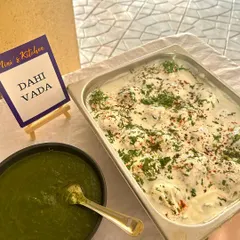 A tray of delicious Dahi Vada, freshly prepared and garnished, ready to be added to the buffet line for a Republic Day brunch.