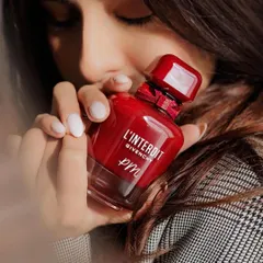 A beautiful shot from an influencer, holding her personalized Givenchy perfume. It's more than a product; it's a personal statement.