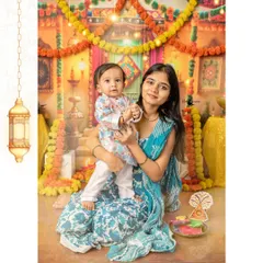 A mother and her son pose together during our special Diwali photoshoot. The set is decorated with marigold garlands and traditional hangings to create an authentic and celebratory atmosphere.