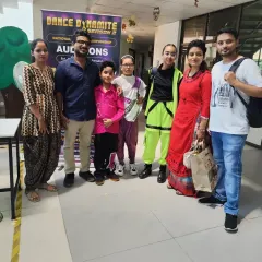 A group photo with students and their proud parents at the national dance championship auditions. Their support is the backbone of our students' success.
