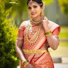 Our antique-finish Kasu Mala (coin necklace) paired with a matching choker and jhumkas. This is a timeless choice for any South Indian bride, adding a touch of heritage to your wedding attire.