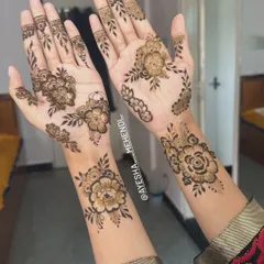 This is a classic Arabic floral design, one of my most requested styles. It's elegant and modern, with delicate flowers and vines that flow beautifully up the arm, perfect for bridesmaids or festival-goers.
