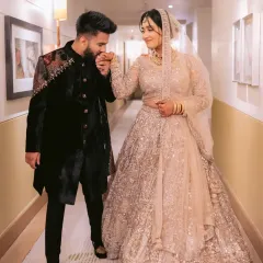 A portrait of togetherness. Here, I have designed a coordinated engagement look where the groom's embellished velvet sherwani perfectly complements the bride's ethereal sequined lehenga, creating a harmonious and regal statement.