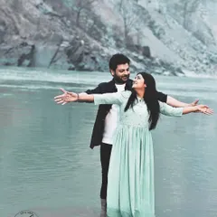 Recreating the iconic Titanic pose in the serene waters of the Ganges in Rishikesh. This destination pre-wedding photo is both playful and romantic, showcasing the couple's adventurous spirit.