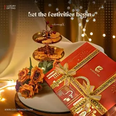 Let the festivities begin with our elegant corporate gifts. This beautiful red box from "The Chocolate Table" is paired with a two-tiered serving platter, creating a sophisticated and memorable gift.