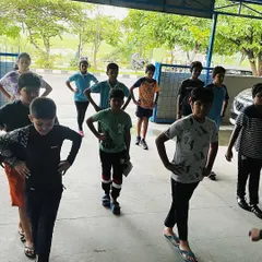 Body balance exercises are crucial for a stable shooting stance. Our athletes are seen here practicing drills to improve their core strength and position.
