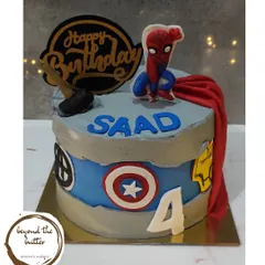 An Avengers inspired cake for a young superhero fan. This design features logos of Thor, Captain America, and Iron Man, and is topped with a dynamic Spiderman figure.