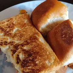 Perfectly toasted pav and bread, ready to be served alongside a steaming bowl of bhaji.
