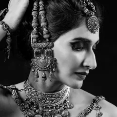A close-up black and white shot focusing on the eye makeup and the stunning detail of the choker and earrings. This demonstrates my skill in creating makeup that is impactful even without color.