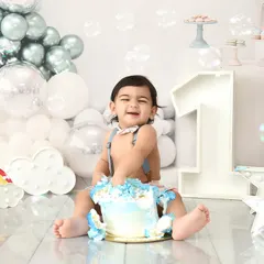 Let's make a mess! A cake smash session is the perfect way to celebrate a first birthday. This little one is having the time of his life, and these are the fun, chaotic, and happy memories you'll cherish.