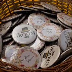Custom 'Team Bride' and 'Team Groom' badges are a fun way to get guests mingling and showing their support. We can design and source all kinds of personalized wedding favors and accessories.