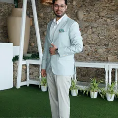 For his sundowner engagement, Samay Parikh wanted something elegant and true to his personality. We crafted this light sage green jacket with cream trousers, a refined look for the day that was easy for the dancefloor.