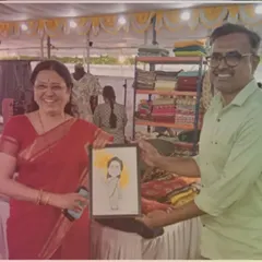 Presenting a framed caricature to Medha Kulkarni. It's an honor to create personalized gifts for respected public figures.